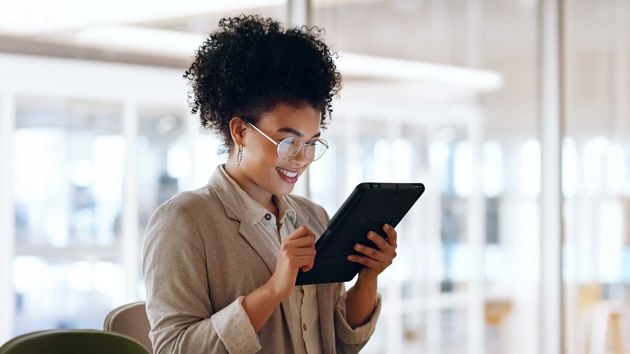 Woman Looking At Ipad 