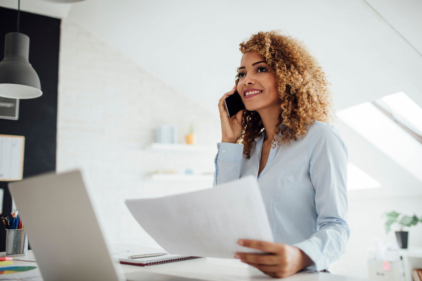 Person Reviewing Documents In Home Office