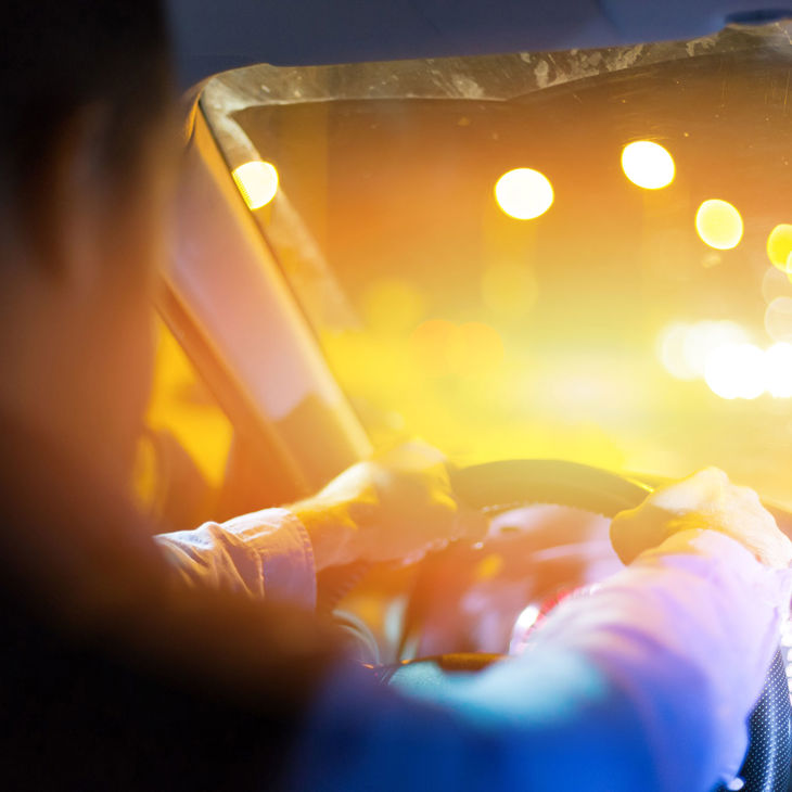 Driver With Oncoming Headlights 