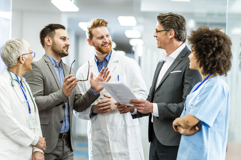 Medical Team Discussing Documents 
