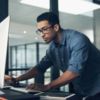 Person Leaning Over Desktop Screen 