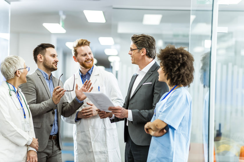 Medical Team Discussing Documents 