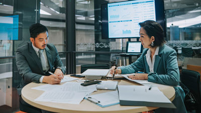 Two Colleagues Reviewing Data 