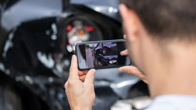 Taking Photo Of Car Accident Damage 