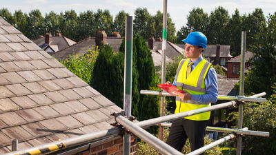 Foreman Reviewing Residential Roof 