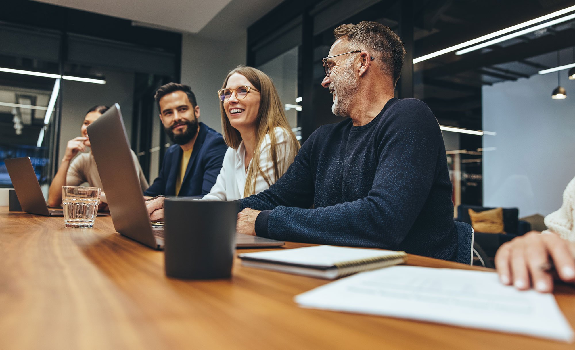 Colleagues Collaborating In Conference Room 
