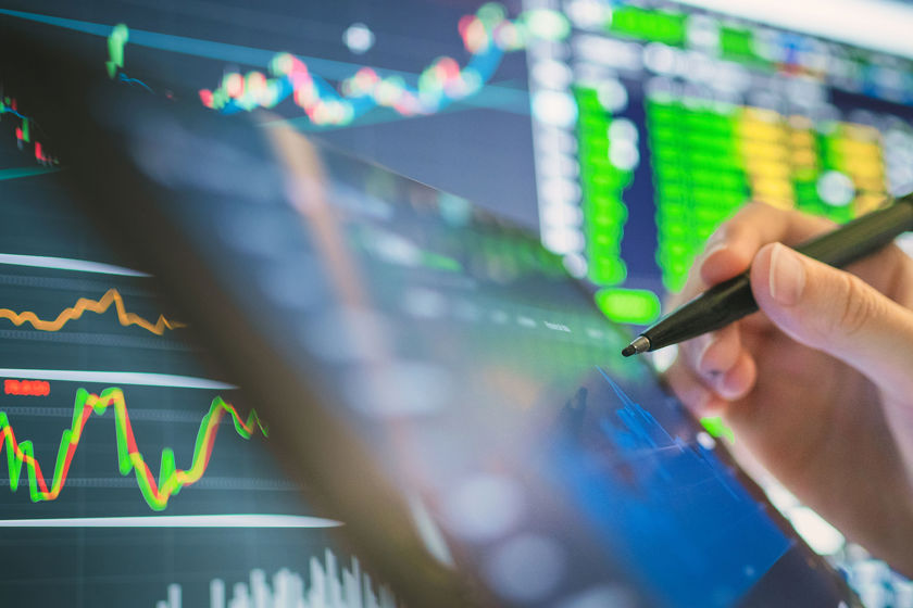 Comparing Data On Computer And Tablet 