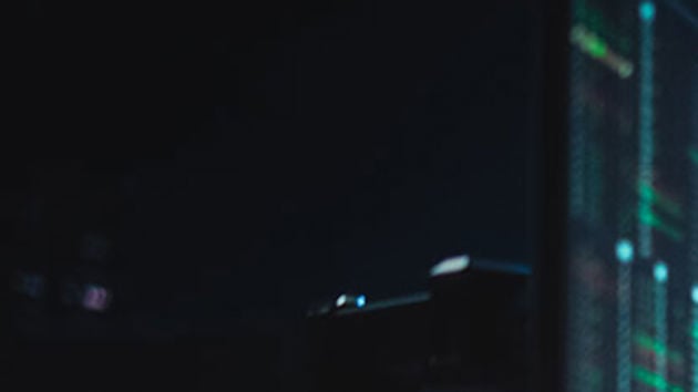 Office Worker Looking At Data In The Evening 