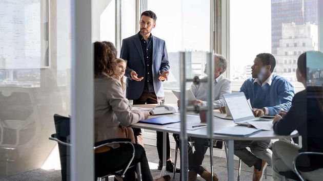 People In Conference Room Discussion 
