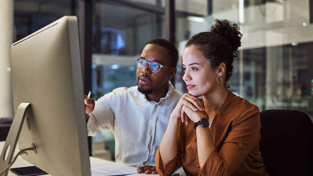 Coworkers On Computer 