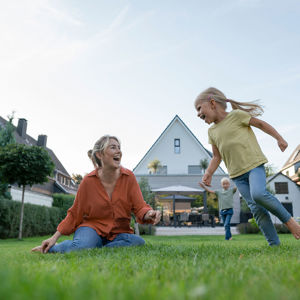 Happy Family Playing In Backyard 