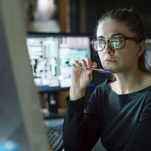 Individual Looking At Desktop Screen 