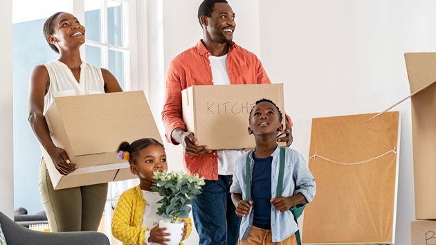 Family Entering New Home After Move 