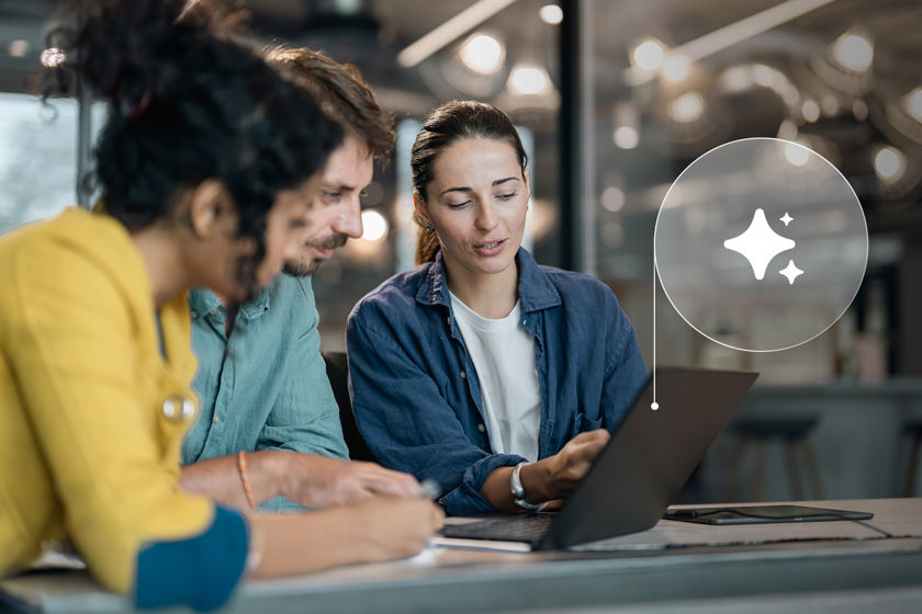Coworkers Reviewing Ai Data On Laptop Screen 