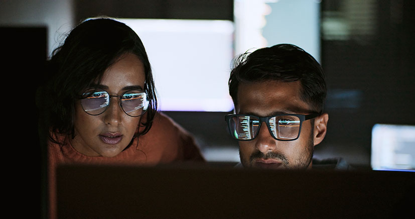 Two Coworkers Reviewing Ai Data 